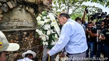 09/05/2023 Colombian Minister of Foreign Affairs Alvaro Leyva places an offering on a cremation chamber where paramilitary groups disappeared their victims during the armed conflict, in the area of Juan Frio in the municipality of Villa del Rosario, Colombia on May 9, 2023. (Photo by Schneyder Mendoza / AFP)