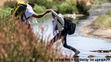 EL PASO, TEXAS - MAY 11: Immigrants step across the Rio Grande from Mexico into the United States on May 11, 2023 in El Paso, Texas. The number of immigrants reaching the border has surged with the end of the U.S. government's Covid-era Title 42 policy, which for the past three years has allowed for the quick expulsion of irregular migrants entering the country. John Moore/Getty Images/AFP (Photo by JOHN MOORE / GETTY IMAGES NORTH AMERICA / Getty Images via AFP)