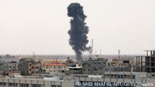 Smoke rises above buildings in Rafah, in the southern Gaza Strip, following an Israeli strike on May 12, 2023. Israel and Gaza militants traded heavy fire, the fourth day of the worst escalation of violence in months, which has killed 29 people in the blockaded Palestinian enclave and one in Israel. (Photo by SAID KHATIB / AFP) (Photo by SAID KHATIB/AFP via Getty Images)