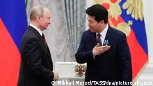 MOSCOW, RUSSIA - MAY 23, 2019: Russia's President Vladimir Putin (L) awards an Order of Friendship to China's Ambassador to Russia Li Hui during a ceremony to present state decorations at the Moscow Kremlin. Mikhail Metzel/TASS