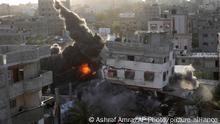 Smoke and fire rise from an explosion caused by an Israeli airstrike targeting a building in Gaza, Saturday, May 13, 2023. The building was owned by an Islamic Jihad official. (AP Photo/Ashraf Amra)