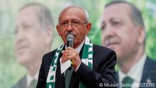 FILE PHOTO: Kemal Kilicdaroglu, presidential candidate of Turkey's main opposition alliance, speaks during a rally ahead of the May 14 presidential and parliamentary elections, as posters of Turkish President Tayyip Erdogan are seen in the background, in Bursa, Turkey May 11, 2023. REUTERS/Murad Sezer/File Photo