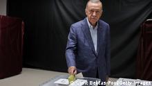 ISTANBUL, TURKEY - MAY 14: Turkish President Recep Tayyip Erdogan casts his vote in Turkey's general elections at a polling station in the Uskudar district on May 14, 2023 in Istanbul, Turkey. Today, President Recep Tayyip Erdogan faces his biggest electoral test as the country goes to the polls in the country's general election. Erdogan has been in power for more than two decades -- first as prime minister, then as president -- but his popularity has recently taken a hit due to Turkey's ongoing economic crisis and his government's response to a series of devastating earthquakes. Meanwhile, the political opposition has united around one candidate, Kemal Kilicdaroglu, with some pre-election polls giving him an edge. (Photo by Umit Bektas-Pool/Getty Images)