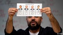 Election officials count ballots at a polling station in Istanbul on May 14, 2023, after polls closed in Turkey's presidental and parliamentary elections. Turkish polling stations have closed in a knife-edge election that could end President Recep Tayyip Erdogan's two-decade grip on power and put the mostly Muslim nation on a more secular course. Turnout was expected to be huge in what has effectively become a referendum on Turkey's longest-serving leader and his Islamic-rooted party. (Photo by Yasin AKGUL / AFP)