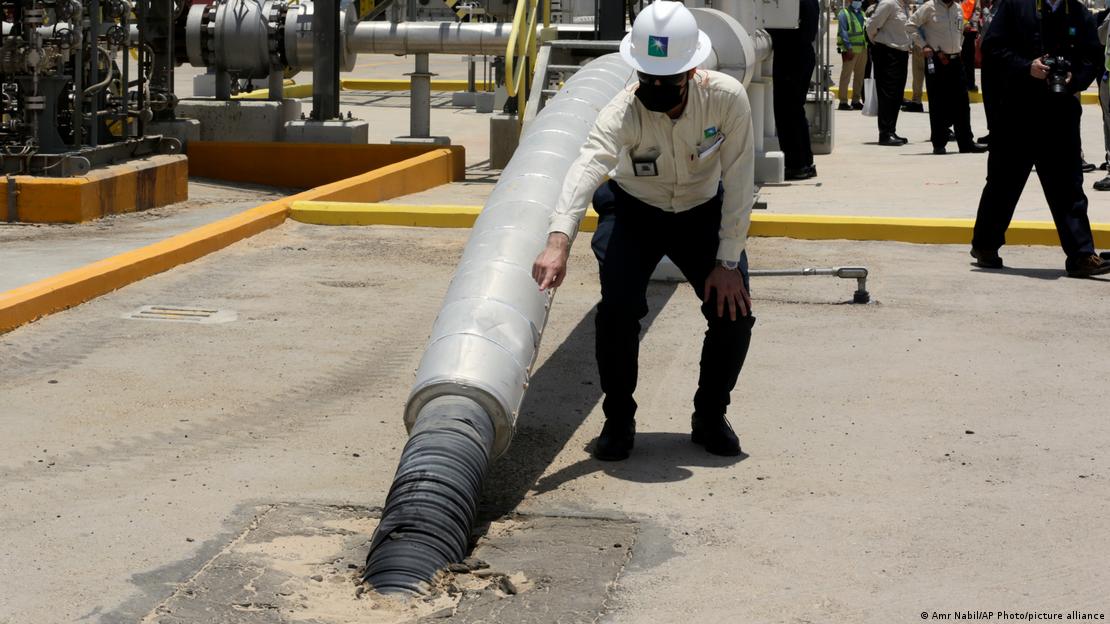 An engineer at a gas plant in Saudi Arabia being used as a pilot project for carbon capture technology