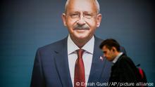 15/05/2023 A man walks past a billboard of Turkish CHP party leader and Nation Alliance's presidential candidate Kemal Kilicdaroglu a day after the presidential election day, in Istanbul, Turkey, Monday, May 15, 2023. Turkey's presidential elections appeared to be heading toward a second-round runoff on Monday, with President Recep Tayyip Erdogan, who has ruled his country with a firm grip for 20 years, leading over his chief challenger, but falling short of the votes needed for an outright win. (AP Photo/Emrah Gurel)