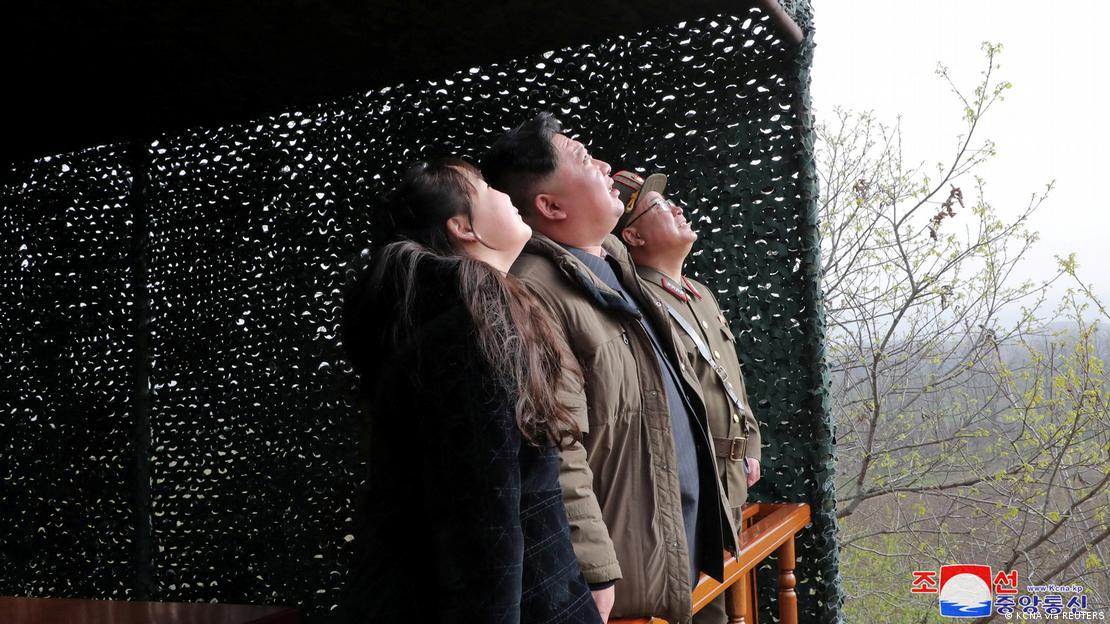 Kim Jong Un and his daughter view a test launch. 