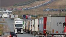 TOPSHOT - Cars (background) are seen queueing on the Russian side of the border with Kazakhstan near the Kazakh Syrym crossing point on September 27, 2022. - Russian President Vladimir Putin announced on September 21 a mobilisation of hundreds of thousands of Russian men to bolster Moscow's army in Ukraine, sparking demonstrations and an exodus of men abroad. (Photo by STRINGER / AFP) (Photo by STRINGER/AFP via Getty Images)