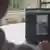 A content moderator looks at a computer screen showing a tank