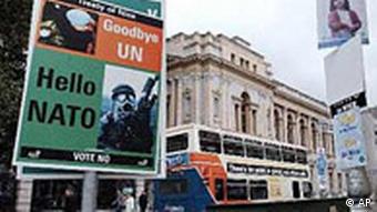 An advertisment by the Irish Referendum Commission on the side of a Dublin bus, passing pro and anti- Nice Treaty posters on lamposts in Dublin, Tuesday Oct. 15, 2002.
