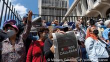Journalists gather outside a court in protest against the detention of award-winning journalist Jose Ruben Zamora, who was arrested the day before, in Guatemala City, Saturday, July 30, 2022. Politicians, anti-corruption activists and civic groups condemned the Guatemalan government’s decision to arrest the investigative journalist, who heads the newspaper El Periodico, which specializes in uncovering corruption. (AP Photo/Moises Castillo)