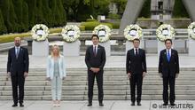 European Council President Charles Michel, Italian Prime Minister Giorgia Meloni, Canadian Prime Minister Justin Trudeau, French President Emmanuel Macron and Japan’s Prime Minister Fumio Kishida pose for a group photo after laying flower wreaths at the Cenotaph for Atomic Bomb Victims in the Peace Memorial Park as part of the G7 Hiroshima Summit in Hiroshima, Japan, 19 May 2023. The G7 Hiroshima Summit will be held from 19 to 21 May 2023. FRANCK ROBICHON/Pool via REUTERS