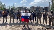 20/05/2023 Founder of Wagner private mercenary group Yevgeny Prigozhin makes a statement as he stand next to Wagner fighters in the course of Russia-Ukraine conflict in Bakhmut, Ukraine, in this still image taken from video released May 20, 2023. Press service of Concord/Handout via REUTERS ATTENTION EDITORS - THIS IMAGE WAS PROVIDED BY A THIRD PARTY. NO RESALES. NO ARCHIVES. MANDATORY CREDIT.

