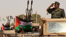 20/05/2023**A Polisario Front soldier salutes during a military parade to celebrate the 50th anniversary of the Polisario Front in the Aoussered camp, Algeria, Saturday, May 20, 2023. The pro-independence Polisario Front, representing the local Sahrawi population and backed by Algeria, fought Moroccan forces for years for control of the Watern Sahara. (AP Photo/Guidoum Fateh)