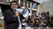 Presidential candidate Carlos Pineda of the Prosperidad Ciudadana party holds a bullhorn after arriving to the Constitutional Court in Guatemala City, Saturday, May 20, 2023. Pineda seeks to reverse a court decision that has excluded him from the electoral process. (AP Photo/Moises Castillo)