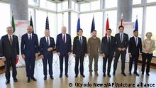 President Joe Biden, fourth left, and Ukrainian President Volodymyr Zelenskyy, fifth right, and other G7 leaders pose for a photo before a working session on Ukraine during the G7 Summit in Hiroshima, Japan, Sunday, May 21, 2023. Other leaders from right to left, European Commission President Ursula von der Leyen, Britain's Prime Minister Rishi Sunak, Canada's Prime Minister Justin Trudeau, France's President Emmanuel Macron, Zelenskyy, Japan's Prime Minister Fumio Kishida, Biden, German Chancellor Olaf Scholz, and European Council President Charles Michel and Gianluigi Benedetti, Italian ambassador to Japan. (Kyodo News via AP)