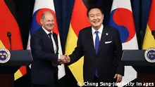 SEOUL, SOUTH KOREA - MAY 21: German Chancellor Olaf Scholz (L) shakes hands with South Korea’s President Yoon Suk Yeol (R) after their joint press conference at the Presidential Office on May 21, 2023 in Seoul, South Korea. Olaf Scholz arrived in Seoul on Sunday for the summit with Yoon after attending a G7 summit in Hiroshima, Japan. (Photo by Chung Sung-Jun/Getty Images)