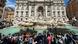A crow of photographers takes pictures of activists in the Trevi Fountain A crow of photographers takes pictures of activists in the Trevi Fountain
