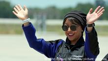 Saudi Arabian astronaut Rayyanah Barnawi waves to family and friends as she arrives at the Kennedy Space Center in Cape Canaveral, Fla., for a scheduled launch Sunday, May 21, 2023. (AP Photo/John Raoux)