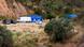 Vehicles and tents of Portugal's investigative Judicial Police are seen at the site of a remote reservoir Vehicles and tents of Portugal's investigative Judicial Police are seen at the site of a remote reservoir