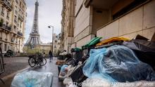 Uncollected garbage pile is on a street near Eiffel Tower in Paris, Friday, March 24, 2023. French President Macron's office says state visit by Britain's King Charles III is postponed amid mass strikes and protests. (AP Photo/Thomas Padilla)