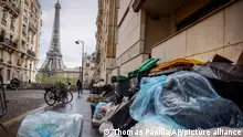 Uncollected garbage pile is on a street near Eiffel Tower in Paris, Friday, March 24, 2023. French President Macron's office says state visit by Britain's King Charles III is postponed amid mass strikes and protests. (AP Photo/Thomas Padilla)