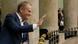 Donald Tusk waves from the gallery of the Polish parliament