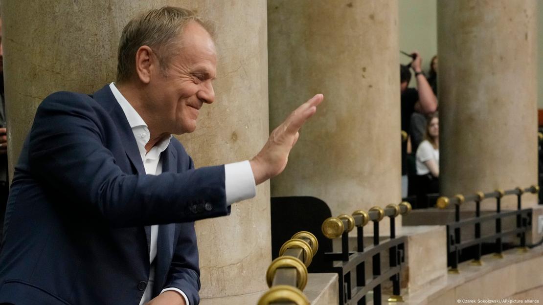 Donald Tusk waves from the gallery of the Polish parliament Donald Tusk waves from the gallery of the Polish parliament