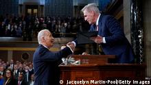 WASHINGTON, DC - FEBRUARY 07: US President Joe Biden shakes hands as he presents a copy of his speech to House Speaker Kevin McCarthy of Calif., before he delivers his State of the Union address to a joint session of Congress, on February 7, 2023 in the House Chamber of the U.S. Capitol in Washington, DC. The speech marks President Biden's first address to the new Republican-controlled House. (Photo by Jacquelyn Martin-Pool/Getty Images)