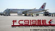 China's first domestically produced passenger jet C919 sits on the tarmac before its first commercial flight from Shanghai to Beijing, in Shanghai Hongqiao Airport on May 28, 2023. China's first domestically produced passenger jet took off on its maiden commercial flight on May 28, a milestone event in the nation's decades-long effort to compete with Western rivals in the air. (Photo by CNS / AFP) / China OUT (Photo by STR/CNS/AFP via Getty Images)