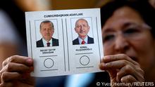 A person holds a ballot at a polling station during the second round of the presidential election in Ankara, Turkey May 28, 2023. REUTERS/Yves Herman TPX IMAGES OF THE DAY 