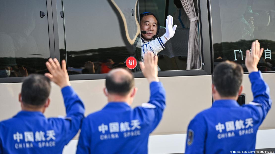 Astronaut waving before the launch of the rocket