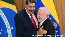 Venezuela's President Nicolas Maduro (L) and Brazil's President Luiz Inacio Lula da Silva (R) greet each other after a joint press conference at the Planalto Palace in Brasilia on May 29, 2023. Brazilian President Luiz Inacio Lula da Silva met Monday with his Venezuelan counterpart Nicolas Maduro, renewing a relationship severed under far-right ex-president Jair Bolsonaro. Lula invited Maduro to the Brazilian capital along with the rest of South America's leaders for a retreat Tuesday aimed at rebooting regional cooperation. It will be the first regional summit in nearly a decade. (Photo by EVARISTO SA / AFP) (Photo by EVARISTO SA/AFP via Getty Images)