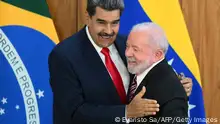 Venezuela's President Nicolas Maduro (L) and Brazil's President Luiz Inacio Lula da Silva (R) greet each other after a joint press conference at the Planalto Palace in Brasilia on May 29, 2023. Brazilian President Luiz Inacio Lula da Silva met Monday with his Venezuelan counterpart Nicolas Maduro, renewing a relationship severed under far-right ex-president Jair Bolsonaro. Lula invited Maduro to the Brazilian capital along with the rest of South America's leaders for a retreat Tuesday aimed at rebooting regional cooperation. It will be the first regional summit in nearly a decade. (Photo by EVARISTO SA / AFP) (Photo by EVARISTO SA/AFP via Getty Images)