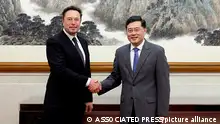 In this photo taken Tuesday, May 30 2023 and released by Ministry of Foreign Affairs of the People's Republic of China, China's Foreign Minister Qin Gang, right, poses for photos with Tesla Ltd. CEO Elon Musk in Beijing. China’s foreign minister met Tesla Ltd. CEO Elon Musk on Tuesday and said strained U.S.-Chinese relations require “mutual respect,” while delivering a message of reassurance that foreign companies are welcome. (Ministry of Foreign Affairs of the People's Republic of China via AP)