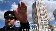 May 30, 2023**TOPSHOT - A police officer secures an area outside a damaged multi-storey apartment building after a reported drone attack in Moscow on May 30, 2023. (Photo by Kirill KUDRYAVTSEV / AFP) (Photo by KIRILL KUDRYAVTSEV/AFP via Getty Images)