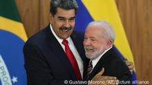 Venezuela's President Nicolas Maduro, left, and Brazilian President Luiz Inacio Lula da Silva end a press conference at Planalto palace in Brasilia, Brazil, Monday, May 29, 2023. Maduro is in Brazil for the summit by the Union of South American Nations (UNASUR) that starts on Tuesday. (AP Photo/Gustavo Moreno)