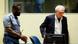 Former Serbian spy chief Jovica Stanisic escorted by police officer to court in The Hague Former Serbian spy chief Jovica Stanisic escorted by police officer to court in The Hague