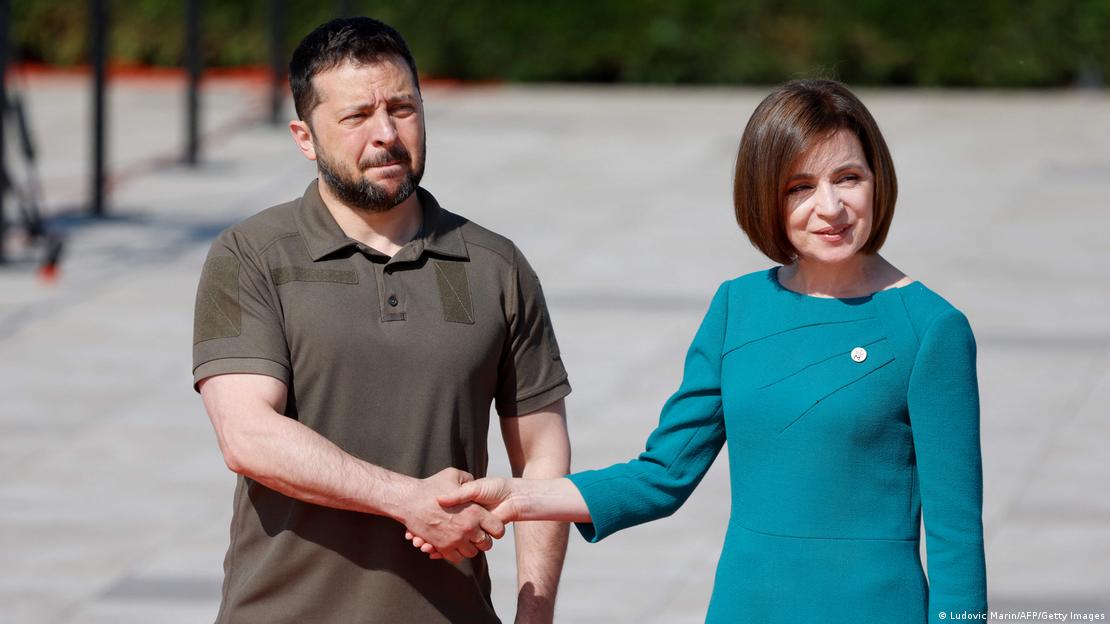 Volodymyr Zelenskyy shaking hands with Maia Sandu Volodymyr Zelenskyy shaking hands with Maia Sandu