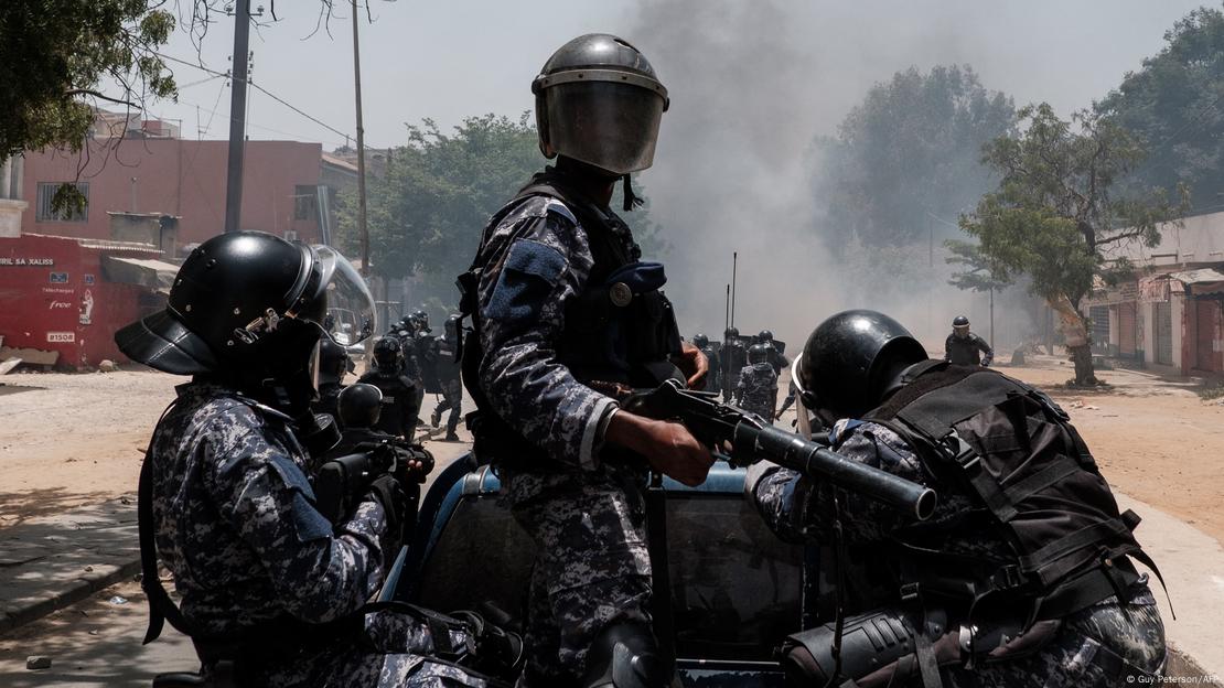 Police fire tear gas from the back of a pickup truck at protesters in Dakar on June 1, 2023