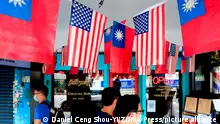 August 10, 2021, Taipei, Taipei, Taiwan: People walk past US-Taiwan flags which are hung outside an eatery, amid USA´s ever-changing partnership with Taiwan and the escalating tensions between Taipei and Beijing. The US-Taiwan ties have fostered through military, political, economy, and medical commitments and collaborations including arms sale and trade deals from Washington, whilst the intensifying threats of China unifying Taiwan have brought uncertainty to the stability of regional security for south east Asia, according to some critics. (Credit Image: Â© Daniel Ceng Shou-Yi/ZUMA Press Wire