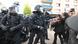 A row of protesters and police standing face to face. In the foreground, a police officer's outstretched arm is reaching towards the demonstrators. Leipzig, Germany, June 3, 2023. A row of protesters and police standing face to face. In the foreground, a police officer's outstretched arm is reaching towards the demonstrators. Leipzig, Germany, June 3, 2023.