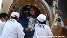 230604 -- DONGFENG LANDING SITE, June 4, 2023 -- Astronaut Fei Junlong is seen coming out of the return capsule of the Shenzhou-15 manned spaceship at the Dongfeng landing site in north China s Inner Mongolia Autonomous Region June 4, 2023. The return capsule of the Shenzhou-15 manned spaceship, carrying astronauts Fei Junlong, Deng Qingming and Zhang Lu, touched down at the Dongfeng landing site in north China s Inner Mongolia Autonomous Region safely on Sunday. EyesonSciCHINA-SHENZHOU-15-RETURN CN HexShuchen PUBLICATIONxNOTxINxCHN