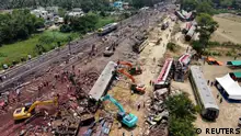 04.06.2023 A drone view shows diggers remove damaged coaches following trains collision in Balasore district in the eastern state of Odisha, India, June 4, 2023. REUTERS/Stringer NO RESALES. NO ARCHIVES.