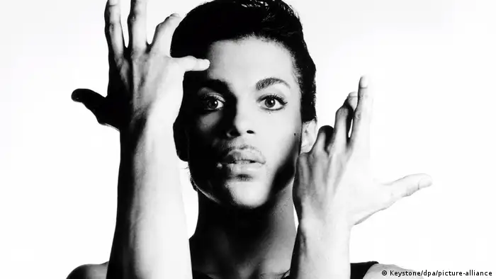 Prince Singer Neck US singer Prince holding his hands up alongside his face