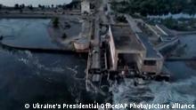 This image made from video provided by Ukraine's Presidential Office shows the damaged Kakhovka dam near Kherson, Ukraine, Tuesday, June 6, 2023. Ukraine on Tuesday accused Russian forces of blowing up a major dam and hydroelectric power station in a part of southern Ukraine that Russia controls, sending water gushing from the breached facility and risking massive flooding. (Ukraine's Presidential Office via AP)