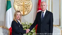 Tunisian President Kais Saied, right, welcomes Italian Prime Minister Giorgia Meloni at the Carthage presidential palace in Tunis, Tunisia, Tuesday, June 6, 2023. (Slim Abid/ Tunisian Presidential Palace via AP)