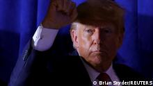 FILE PHOTO: Former U.S. President and Republican presidential candidate Donald Trump gestures during a campaign event in Manchester, New Hampshire, U.S., April 27, 2023. REUTERS/Brian Snyder/File Photo