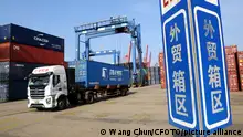 LIANYUNGANG, CHINA - JUNE 7, 2023 - A transport vehicle delivers containers to a cargo ship at the container terminal in Lianyungang Port, east China's Jiangsu province, June 7, 2023. On June 7, 2023, data released by the General Administration of Customs showed that in the first five months of this year, the total value of China's foreign trade import and export was 16.77 trillion yuan, an increase of 4.7%, of which the export was 9.62 trillion yuan, an increase of 8.1%; Imports reached 7.15 trillion yuan, up 0.5% year on year.
