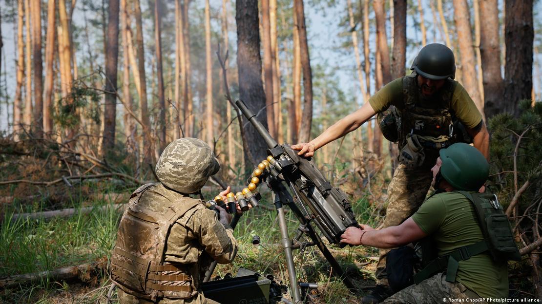 Ukrainian soldiers fire a grenade launcher towards the Russian positions on the frontline near Kreminna, Luhansk region, Ukraine, Thursday, June 8, 2023.